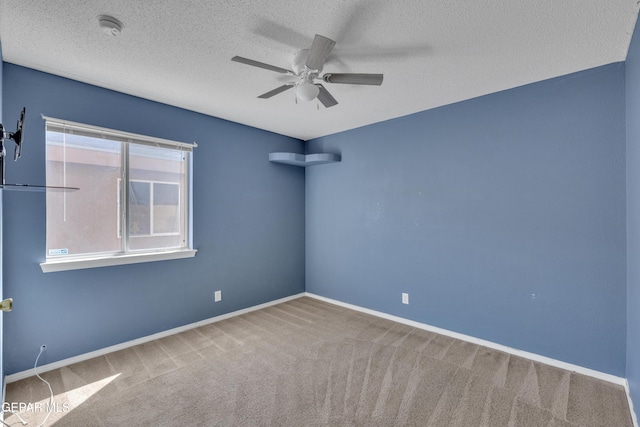 11905 Jim Webb Dr, El Paso, TX 79934 - spare room with ceiling fan, a smoke detector, carpet flooring, and a textured ceiling