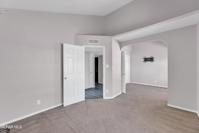 11905 Jim Webb Dr, El Paso, TX 79934 - carpeted empty room featuring arched walkways and baseboards