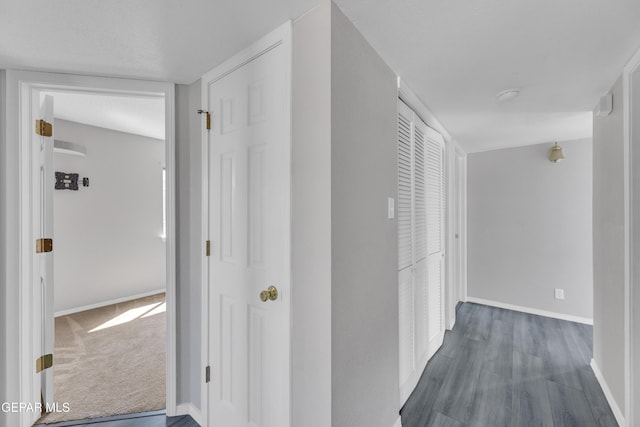 11905 Jim Webb Dr, El Paso, TX 79934 - hall with baseboards and dark wood-type flooring