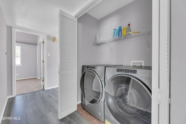 11905 Jim Webb Dr, El Paso, TX 79934 - laundry area with washer and clothes dryer and wood finished floors