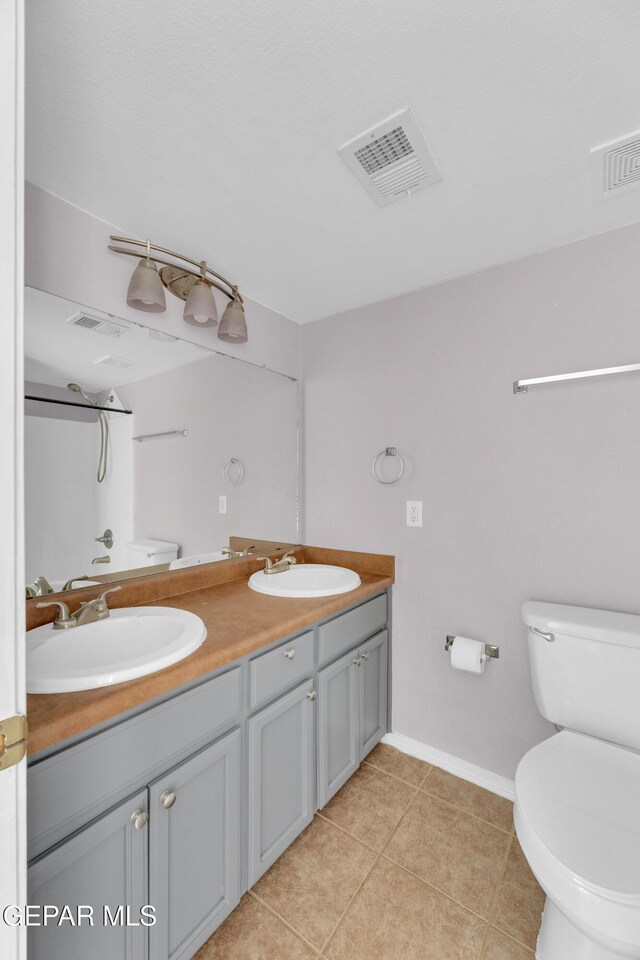 11905 Jim Webb Dr, El Paso, TX 79934 - full bathroom featuring double vanity and tile patterned floors