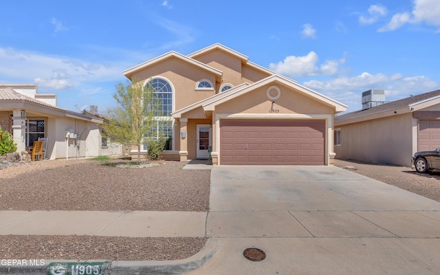 11905 Jim Webb Dr, El Paso, TX 79934 - view of front of property featuring an attached garage, stucco siding, and concrete driveway
