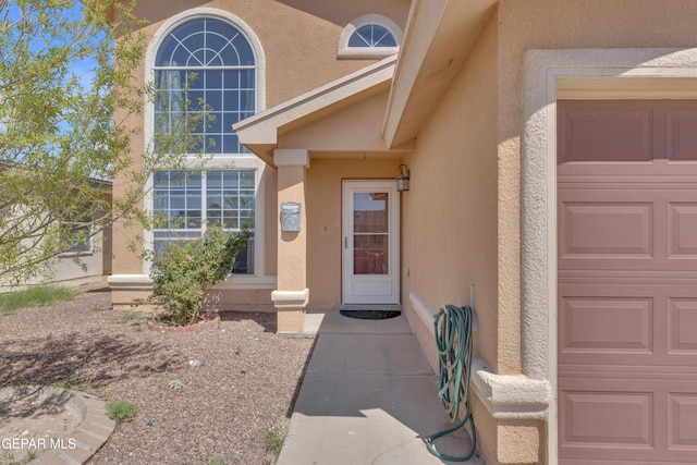 11905 Jim Webb Dr, El Paso, TX 79934 - entrance to property featuring stucco siding and an attached garage
