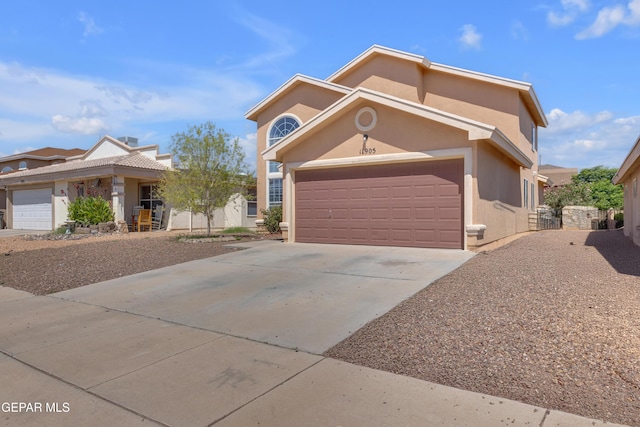 11905 Jim Webb Dr, El Paso, TX 79934 - view of front of property with driveway, stucco siding, and an attached garage