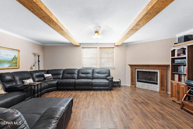 12090 Sterling Mary Way, El Paso, TX 79936 - living room featuring beamed ceiling, ceiling fan, a fireplace, wood finished floors, and ornamental molding
