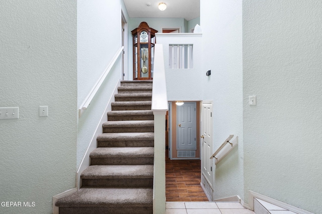 12090 Sterling Mary Way, El Paso, TX 79936 - stairway featuring a textured wall and baseboards