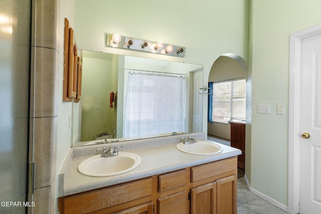 12090 Sterling Mary Way, El Paso, TX 79936 - bathroom featuring double vanity and tile patterned flooring