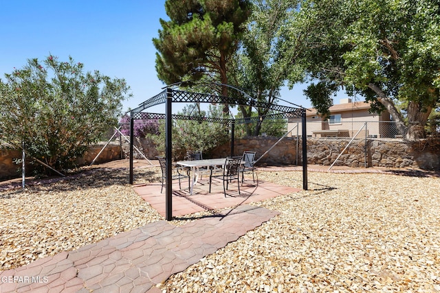 12090 Sterling Mary Way, El Paso, TX 79936 - fenced backyard featuring a gazebo and a patio area