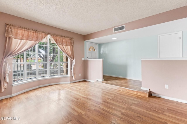 4821 Round Rock Dr, El Paso, TX 79924 - unfurnished room featuring wood finished floors and a textured ceiling