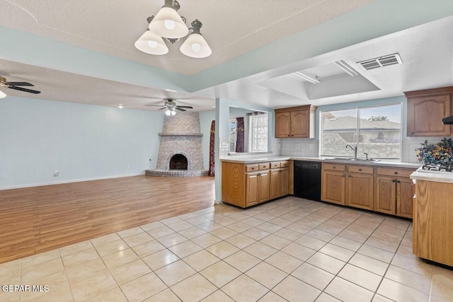 4821 Round Rock Dr, El Paso, TX 79924 - kitchen featuring dishwasher, a ceiling fan, open floor plan, and a tray ceiling