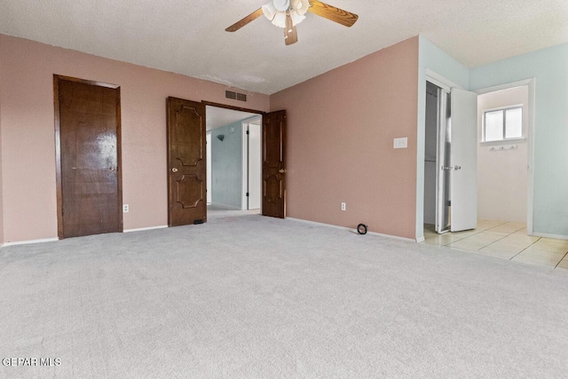 4821 Round Rock Dr, El Paso, TX 79924 - unfurnished bedroom with light colored carpet and ceiling fan