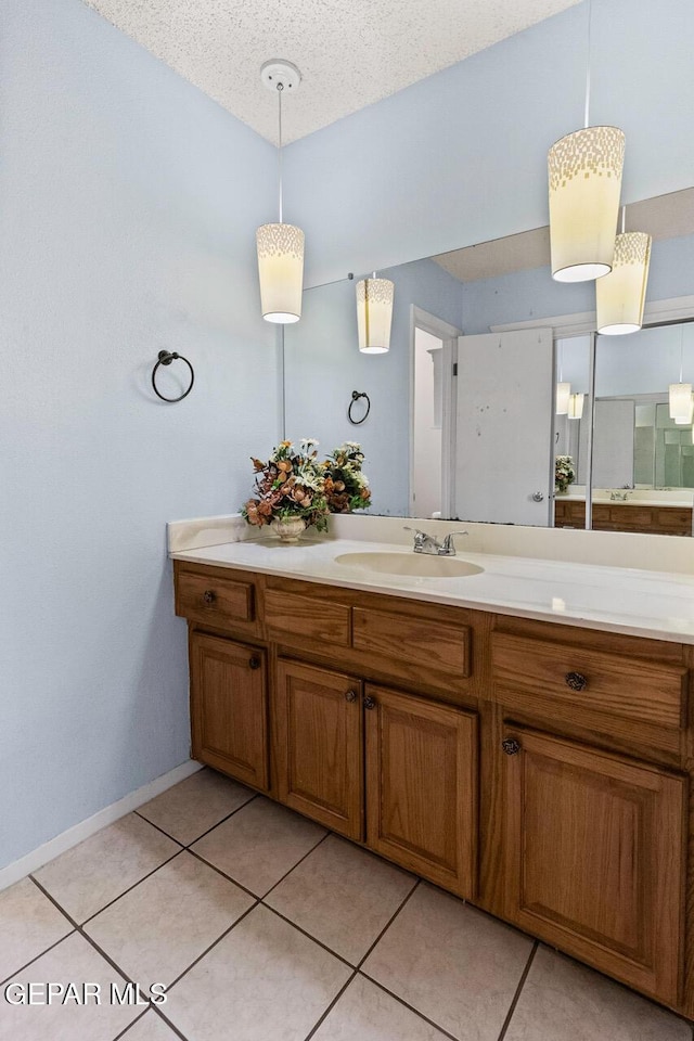 4821 Round Rock Dr, El Paso, TX 79924 - bathroom with vanity, tile patterned flooring, and a textured ceiling