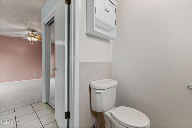 4821 Round Rock Dr, El Paso, TX 79924 - bathroom featuring tile patterned floors, ceiling fan, and a textured ceiling