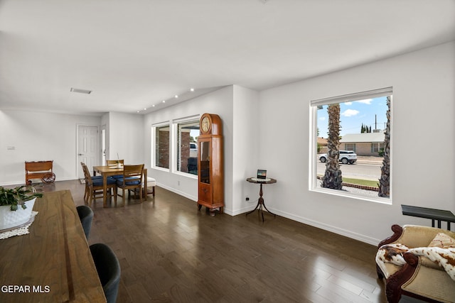 10121 Monaco Dr, El Paso, TX 79925 - living area featuring healthy amount of natural light, dark wood finished floors, and recessed lighting