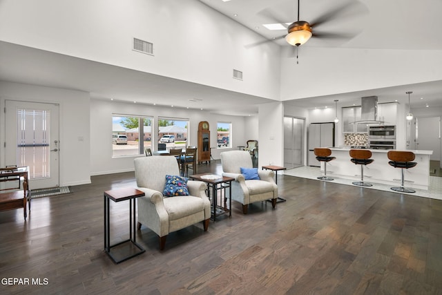 10121 Monaco Dr, El Paso, TX 79925 - living room featuring dark wood finished floors, a ceiling fan, and a high ceiling