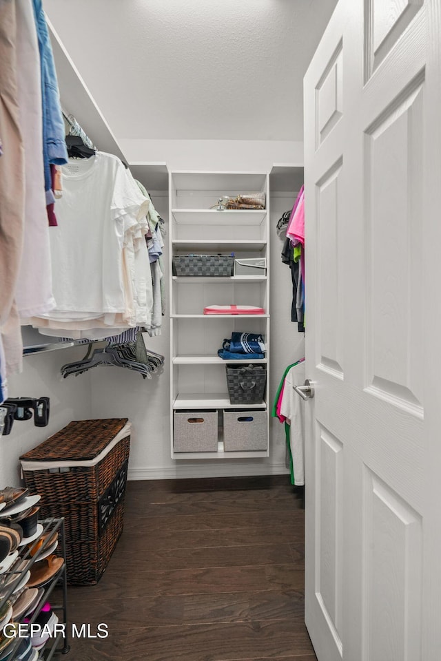 10121 Monaco Dr, El Paso, TX 79925 - walk in closet with dark wood-type flooring