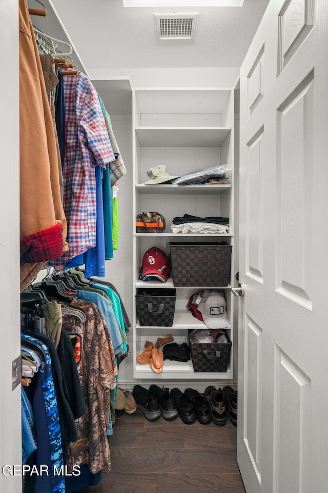 10121 Monaco Dr, El Paso, TX 79925 - walk in closet with wood finished floors