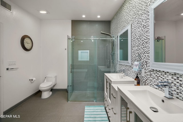 10121 Monaco Dr, El Paso, TX 79925 - full bath with a stall shower, two vanities, backsplash, tile patterned floors, and recessed lighting