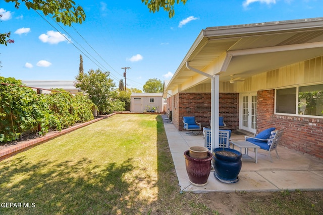 10121 Monaco Dr, El Paso, TX 79925 - fenced backyard featuring french doors, ceiling fan, a patio area, and an outdoor structure