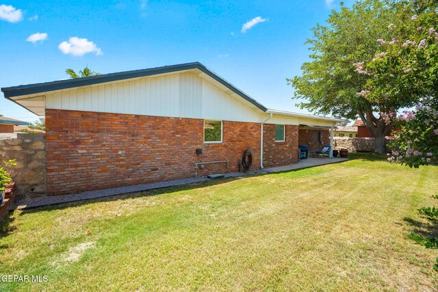 10121 Monaco Dr, El Paso, TX 79925 - rear view of house featuring brick siding and a patio area
