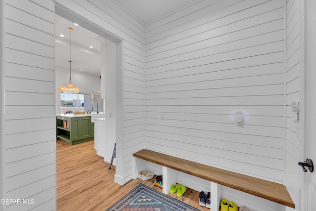 1042 Castillo Ct, El Paso, TX 79932 - mudroom with light wood-type flooring and wooden walls