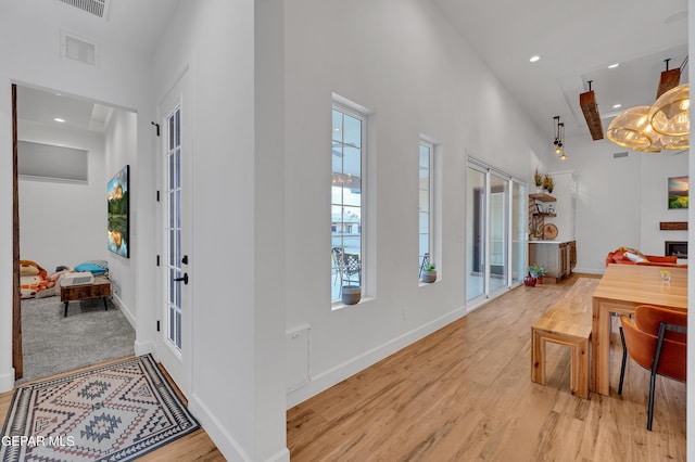 1042 Castillo Ct, El Paso, TX 79932 - entryway with light wood finished floors, recessed lighting, a towering ceiling, and french doors