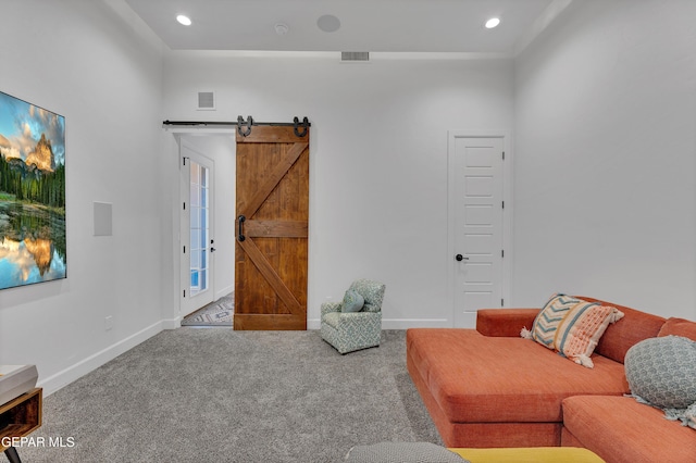 1042 Castillo Ct, El Paso, TX 79932 - carpeted living area featuring a barn door and recessed lighting