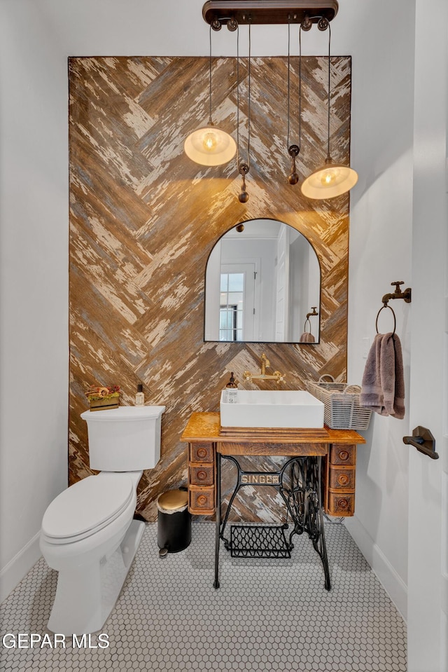 1042 Castillo Ct, El Paso, TX 79932 - half bath with a sink and tile patterned flooring