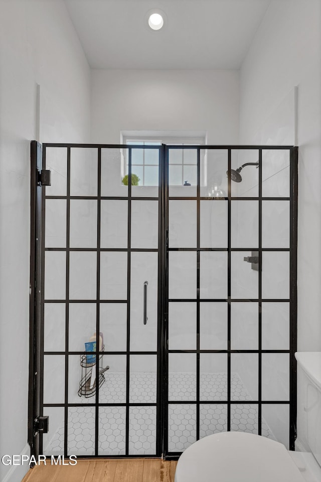1042 Castillo Ct, El Paso, TX 79932 - bathroom with a shower stall and wood finished floors