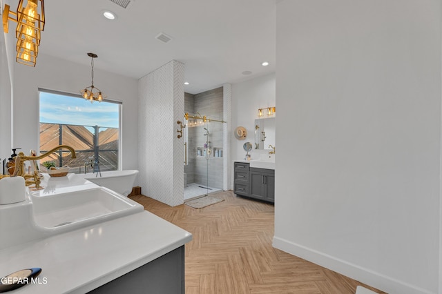 1042 Castillo Ct, El Paso, TX 79932 - bathroom featuring vanity, a stall shower, a soaking tub, a chandelier, and recessed lighting
