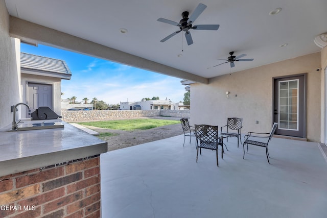 1042 Castillo Ct, El Paso, TX 79932 - fenced backyard with a patio area, a ceiling fan, and area for grilling