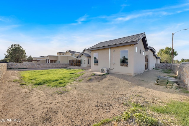 1042 Castillo Ct, El Paso, TX 79932 - back of property featuring a fenced backyard and stucco siding