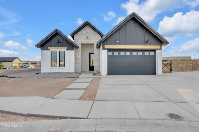 837 Paseo Serra Ct, El Paso, TX 79928 - modern farmhouse style home with board and batten siding, stone siding, driveway, and a garage
