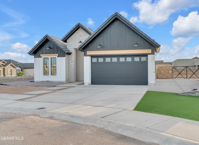 837 Paseo Serra Ct, El Paso, TX 79928 - modern inspired farmhouse featuring board and batten siding, concrete driveway, and an attached garage