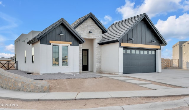 837 Paseo Serra Ct, El Paso, TX 79928 - modern inspired farmhouse featuring board and batten siding, driveway, a garage, and stone siding