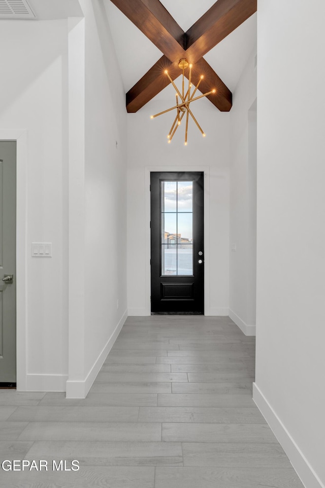 837 Paseo Serra Ct, El Paso, TX 79928 - foyer with a chandelier, light wood-style flooring, and beam ceiling