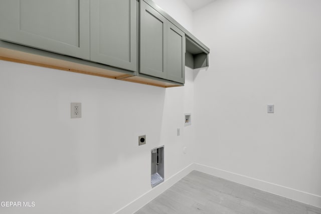 837 Paseo Serra Ct, El Paso, TX 79928 - washroom with electric dryer hookup, cabinet space, hookup for a washing machine, light wood-style floors, and gas dryer hookup
