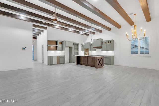 837 Paseo Serra Ct, El Paso, TX 79928 - unfurnished living room with beamed ceiling, a chandelier, light wood-type flooring, and a ceiling fan