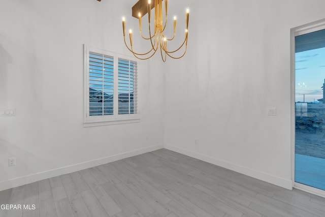 837 Paseo Serra Ct, El Paso, TX 79928 - empty room with wood finished floors and a chandelier