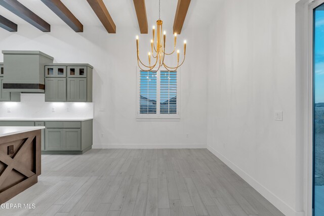 837 Paseo Serra Ct, El Paso, TX 79928 - unfurnished dining area with beam ceiling, a chandelier, and light wood-style flooring