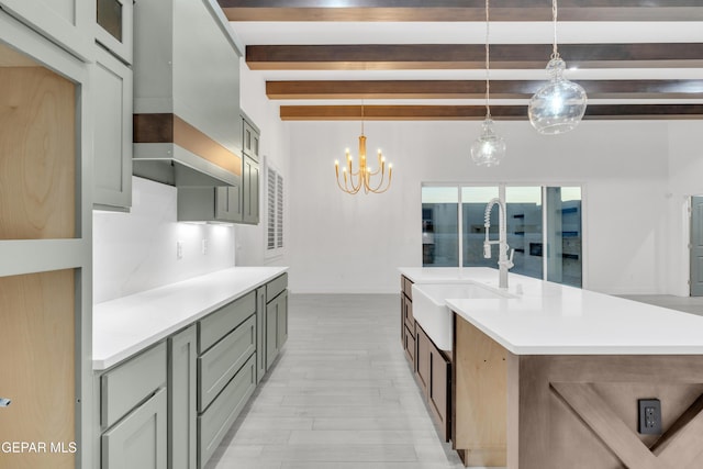 837 Paseo Serra Ct, El Paso, TX 79928 - kitchen with light countertops, beam ceiling, pendant lighting, a chandelier, and light wood-style flooring