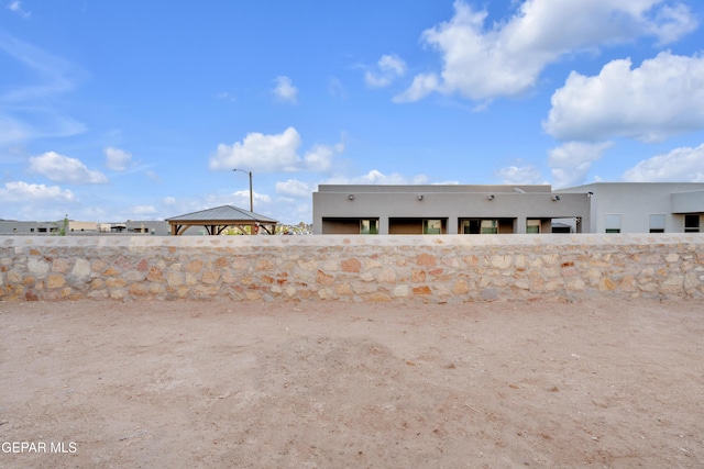 837 Paseo Serra Ct, El Paso, TX 79928 - back of property featuring stucco siding and a gazebo