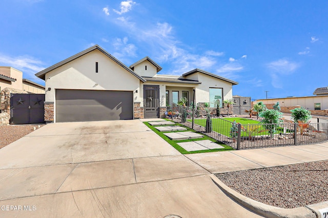 2362 Enchanted Crown Ln, El Paso, TX 79911 - view of front of property with an attached garage, stucco siding, concrete driveway, and stone siding