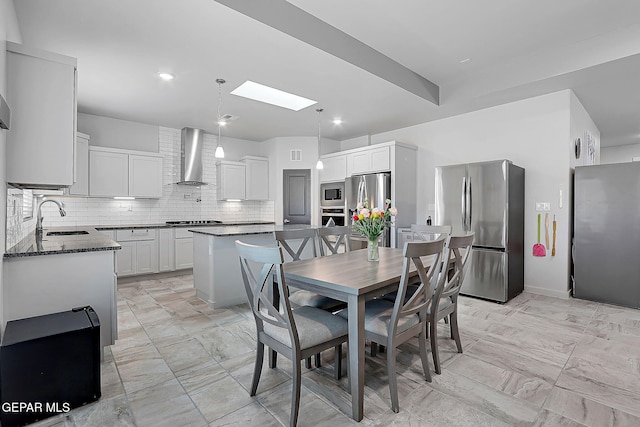 2362 Enchanted Crown Ln, El Paso, TX 79911 - dining area with a skylight, light marble finish flooring, and recessed lighting
