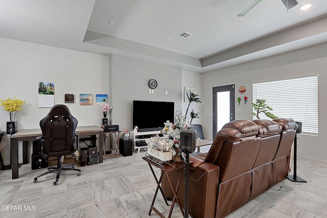 2362 Enchanted Crown Ln, El Paso, TX 79911 - living area with a raised ceiling, a ceiling fan, healthy amount of natural light, and light marble finish flooring