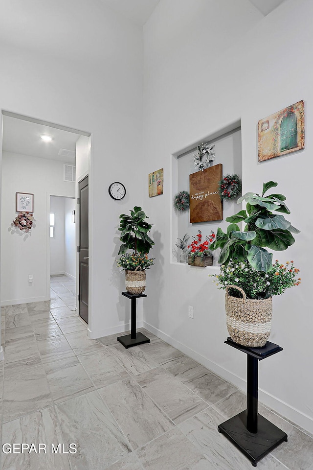 2362 Enchanted Crown Ln, El Paso, TX 79911 - corridor featuring light marble finish floors