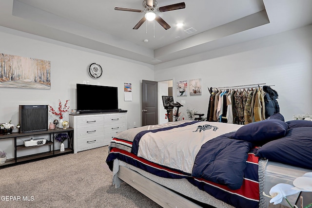 2362 Enchanted Crown Ln, El Paso, TX 79911 - bedroom featuring carpet, a tray ceiling, and a ceiling fan
