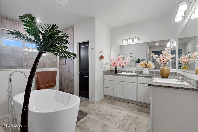 2362 Enchanted Crown Ln, El Paso, TX 79911 - full bathroom with double vanity and a freestanding bath
