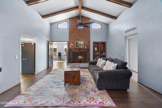 6604 Camino Fuente Dr, El Paso, TX 79912 - living room with a textured wall, a ceiling fan, high vaulted ceiling, wood finished floors, and beam ceiling