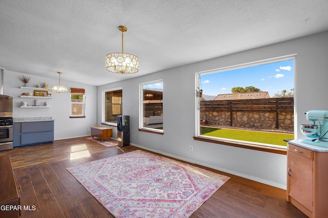 6604 Camino Fuente Dr, El Paso, TX 79912 - dining space featuring a chandelier, a textured ceiling, and dark wood-type flooring